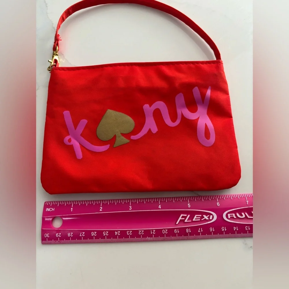 Kate Spade red nylon pouch with pink 